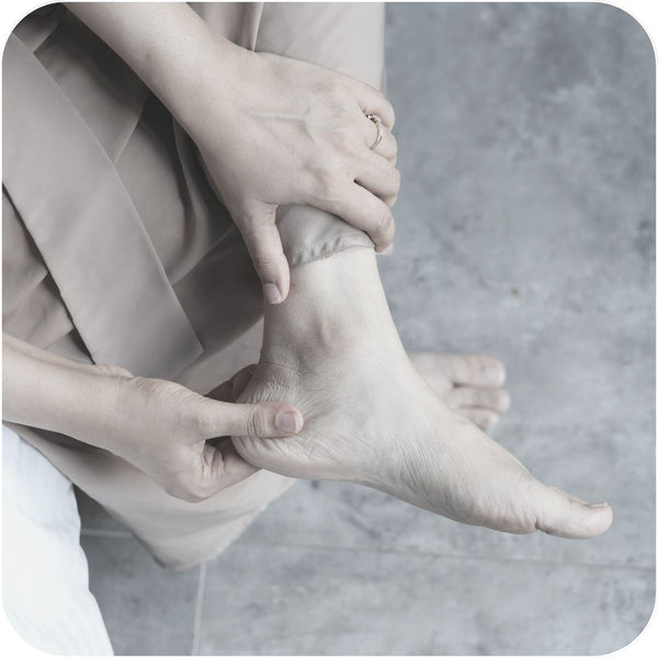 Rubbing foot to get rid of pain