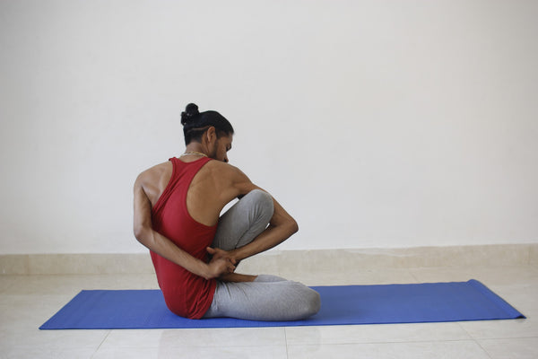 Man doing yoga to keep joints healthy