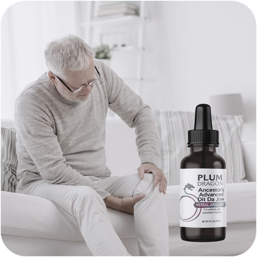 Person experiencing knee joint pain using Plum Dragon herbal liniment