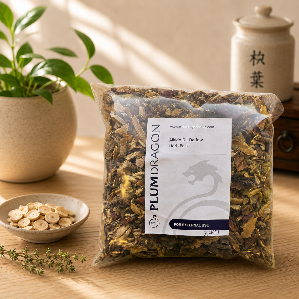 Aikido Dit Da Jow in Plum Dragon Packaging on apothecary counter
