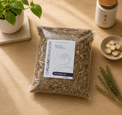 Black Hand Iron Palm Dit Da Jow in Plum Dragon packaging on apothecary counter