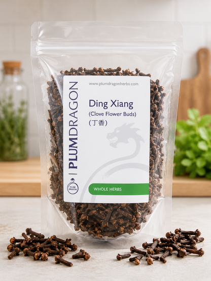 Packaged ding xiang (cloves) with Plum Dragon label on a kitchen counter