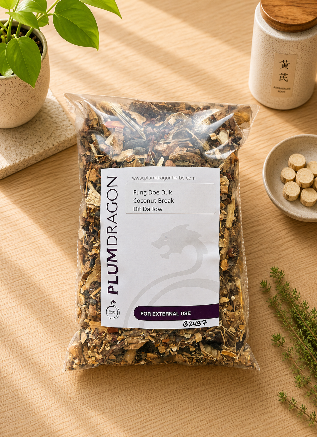 Fung Doe Duk Coconut Break Dit Da Jow in Plum Dragon Packaging on apothecary counter