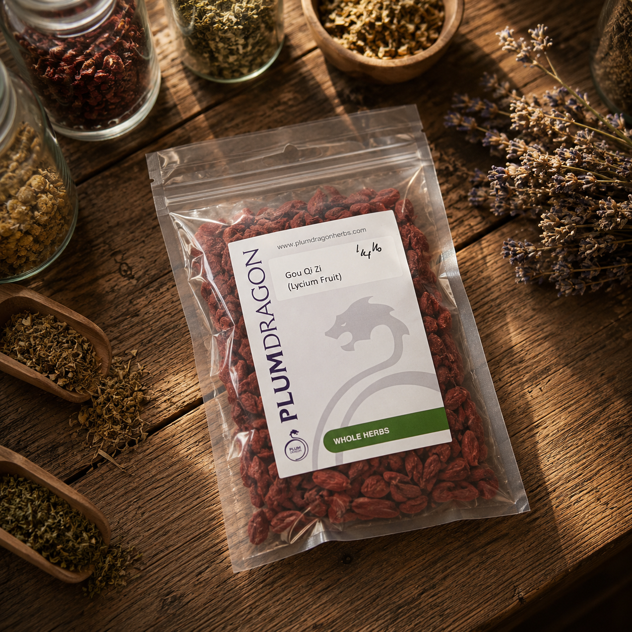 Packaged Gou Qi Zi (goji berries) with Plum Dragon label on a wooden surface with herbs.