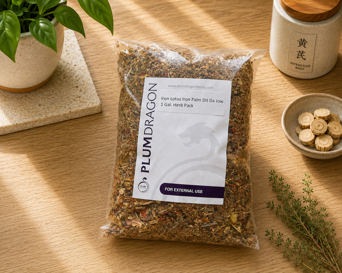 Iron Lotus Iron Palm Dit Da Jow Herbs in Plum Dragon packaging on apothecary counter