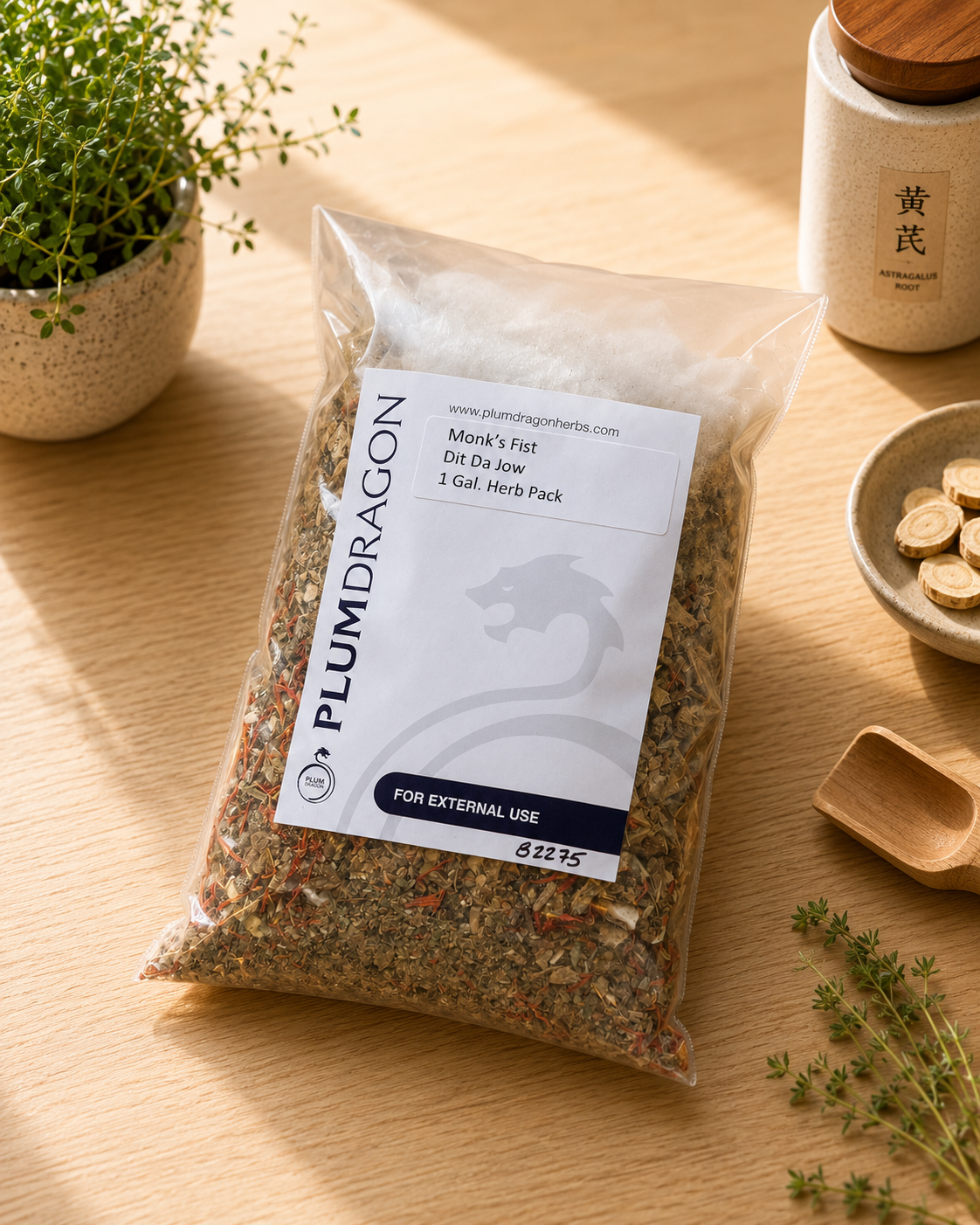 Monk's Fist DIt Da Jow Herbs in Plum Dragon packaging on apothecary counter