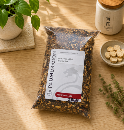 Plum Dragon Chai Training Tea in Plum Dragon Packaging on apothecary counter