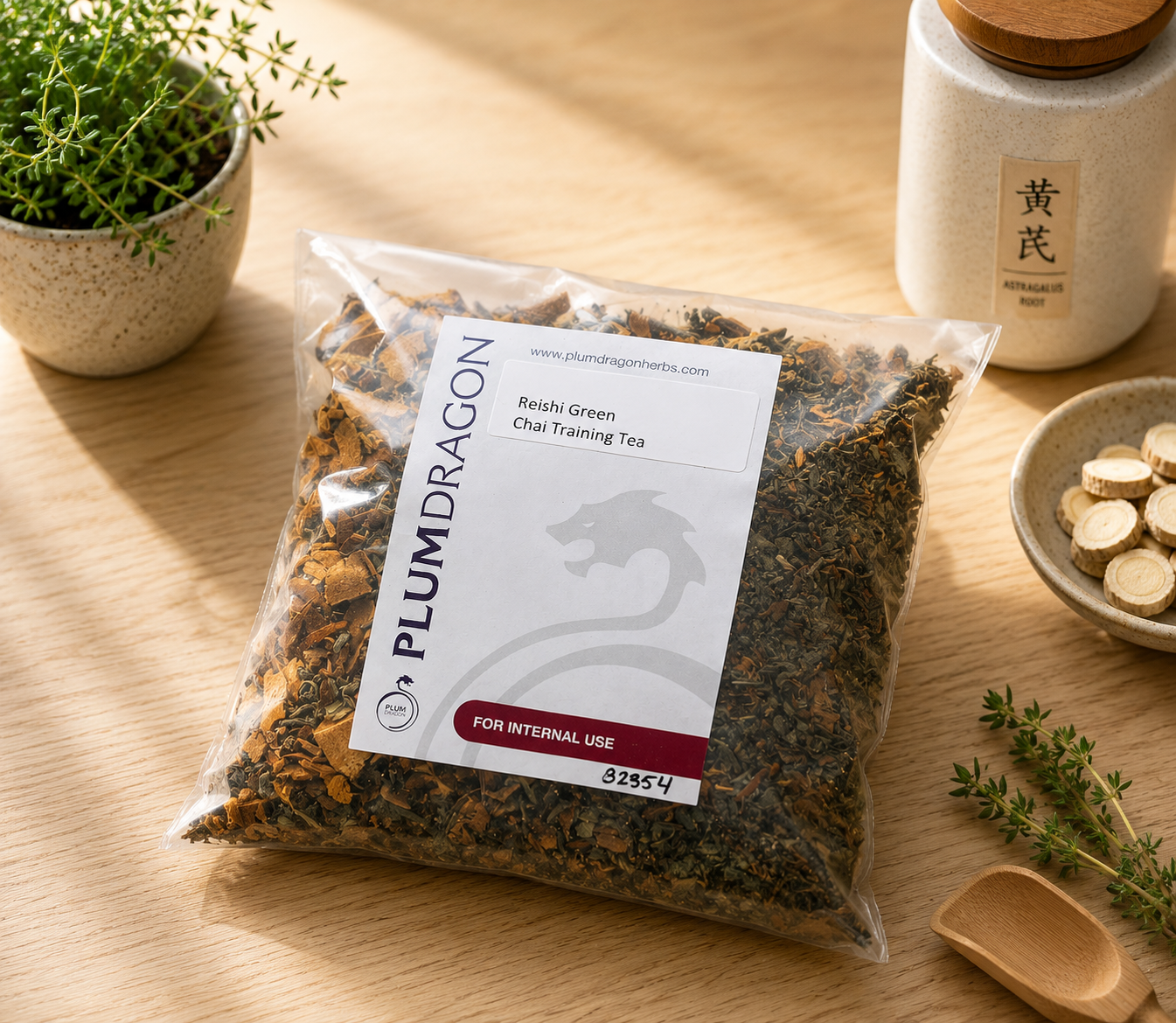 Reishi-Green Chai Training Tea in Plum Dragon packaging on apothecary counter