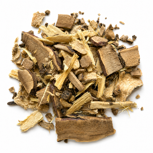 Pile of Reishi and Astragalus Chai Training Tea on white background