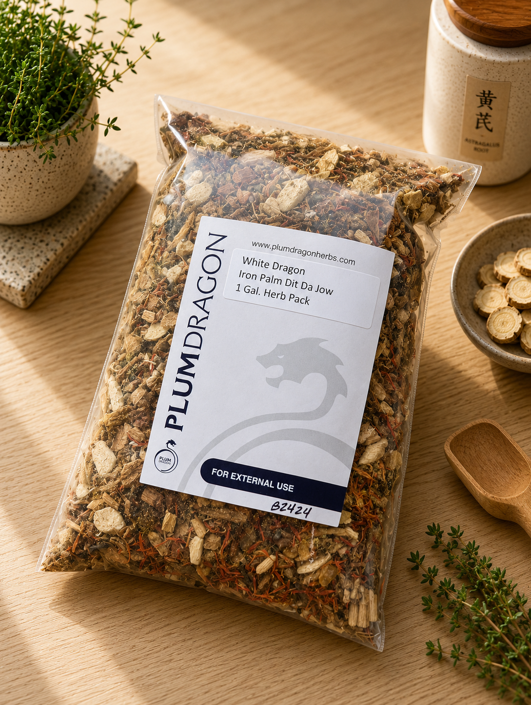White Dragon Iron Palm Dit Da Jow in Plum Dragon packaging on apothecary counter